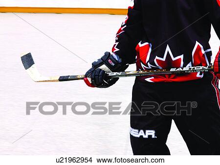 hockey puck, men, one person, people View Large Photo Image Picture - hockey puck, men, one person, people. Fotosearch