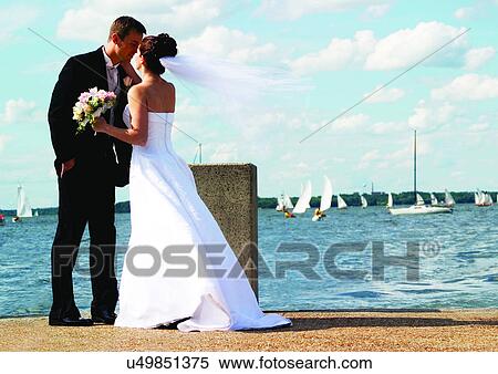 Stock Photography - Holding, Standing, Face To Face. Fotosearch