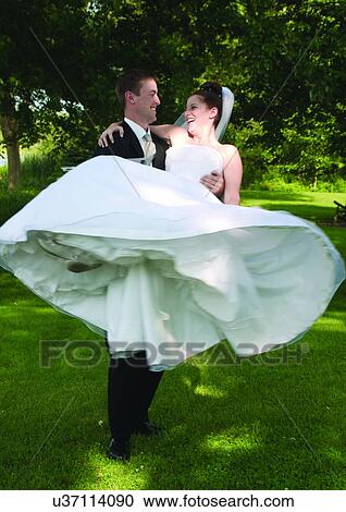 Stock Image - Holding, Standing, Full Suit. Fotosearch