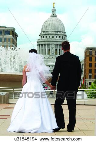 Holding, Walking, Wedding Dress View Large Photo Image Picture - Holding, Walking, Wedding Dress. Fotosearch