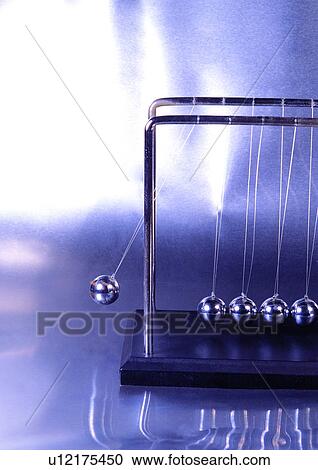 Stock Image - Part Of, Ball, Blurred Motion, Desk Toy. Fotosearch