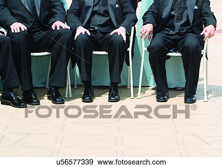 Sitting, People In A Row, Hands On Knees, Full Suit View Large Photo Image Stock Photo - Sitting, People In A Row, Hands On Knees, Full Suit. Fotosearch