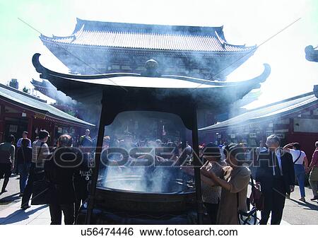 Stock Photograph - Smoke, Large Group Of People, Senso-ji Temple, Place Of Worship, Travel Destination, Structure, Praying. Fotosearch