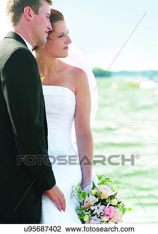 Standing, Holding, Full Suit View Large Photo Image Stock Image - Standing, Holding, Full Suit. Fotosearch
