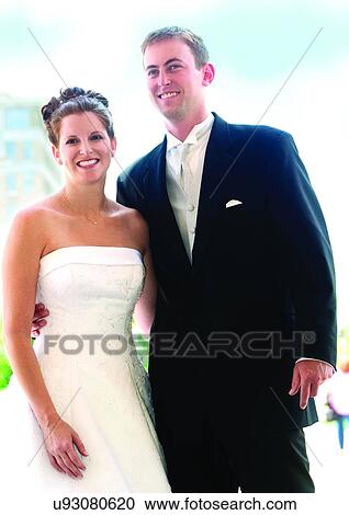 Stock Image - Standing, Smiling, Arm Around. Fotosearch