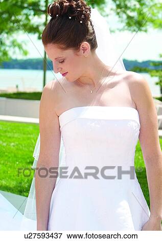 Stock Photo - Standing, Wedding Dress, Veil. Fotosearch