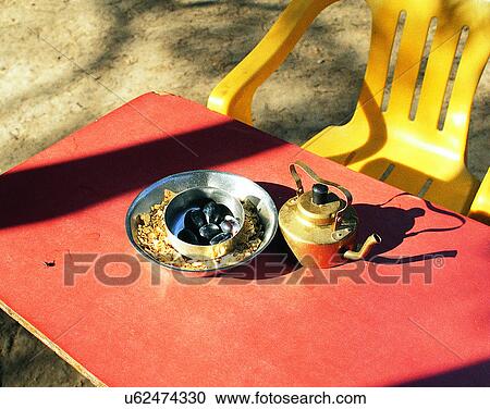 Stock Image - artificial, shadow, table, chairs, tea pot, ashtray. Fotosearch