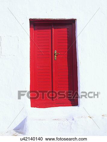 Stock Image - building, Europe, doors, walls, red, shutters. Fotosearch