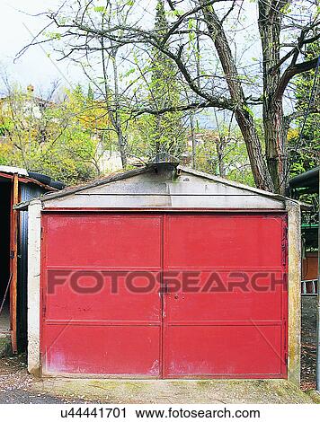Stock Image - building, Europe, doors, walls, shed, trees. Fotosearch