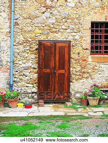 Stock Photo - building, Europe, doors, walls, window, flowers. Fotosearch