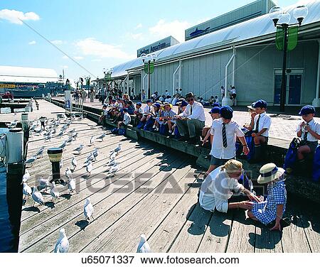 Stock Photo - children, outdoors, people, buildings, pier, Australia. Fotosearch