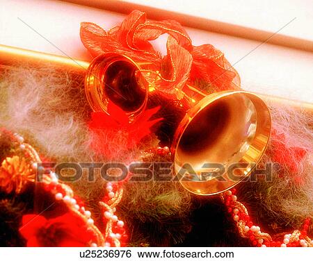 Stock Photograph - Christmas, indoors, decorations, bells, flowers, ribbons. Fotosearch