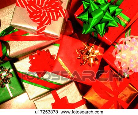 Christmas, indoors, gifts, presents, bows, ribbons View Large Photo Image Stock Photo - Christmas, indoors, gifts, presents, bows, ribbons. Fotosearch