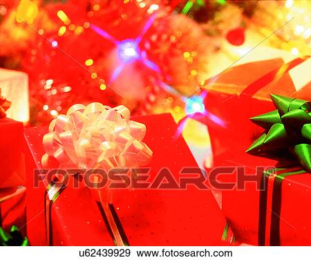 Christmas, indoors, gifts, presents, bows, ribbons View Large Photo Image Stock Photo - Christmas, indoors, gifts, presents, bows, ribbons. Fotosearch