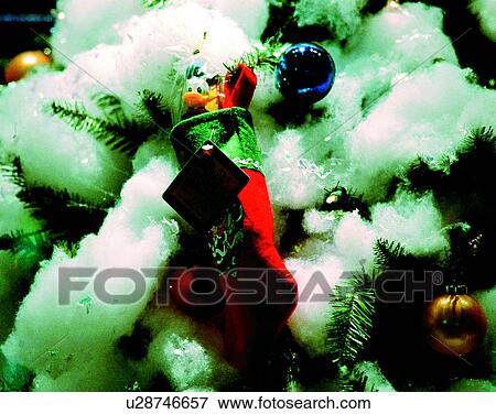 Stock Photo - Christmas, indoors, tree, snow, sock, toys. Fotosearch