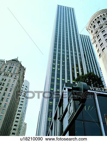 Stock Image - City view, modern look, outdoors, low angel view, sunshine, sky. Fotosearch