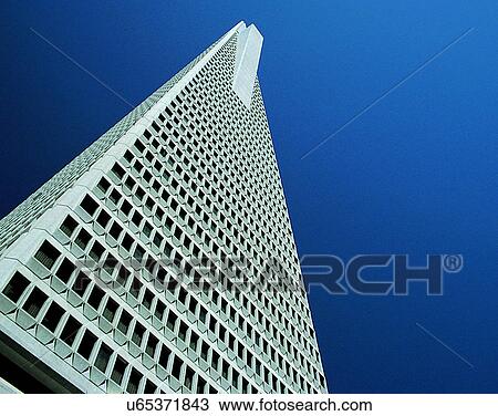 Stock Image - City view, modern look, outdoors, low angel view, sky, windows. Fotosearch
