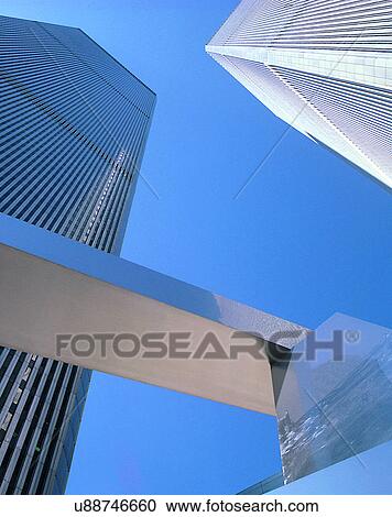 Stock Image - City view, modern look, outdoors, low angel view, sunshine, sky. Fotosearch