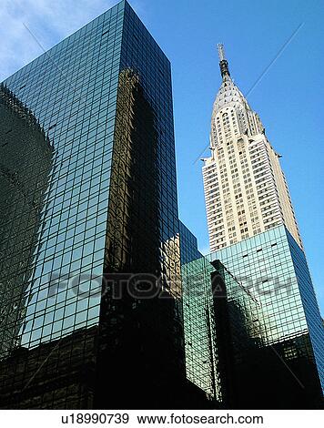 Stock Photo - City view, modern look, outdoors, low angel view, sky, windows. Fotosearch