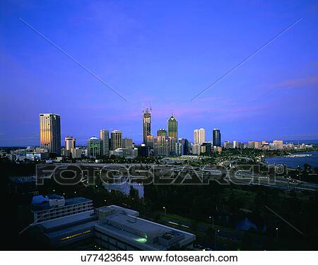Stock Photography - City view, modern look, outdoors, buildings, lights, sky. Fotosearch