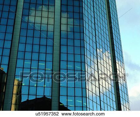 Stock Image - City view, modern look, sky, windows, day time, business. Fotosearch