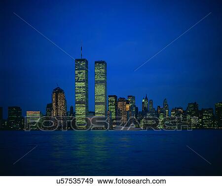 Stock Photo - City view, outdoors, buildings, night time, lights, sky. Fotosearch