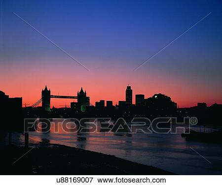 Stock Photo - City view, outdoors, buildings, night time, lights, sky. Fotosearch