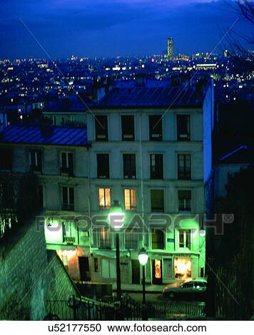 Stock Image - City view, outdoors, night time, buildings, lights, windows. Fotosearch