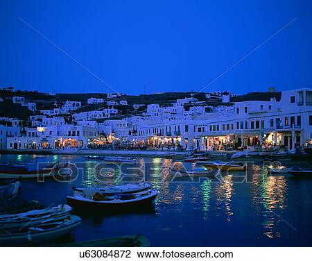 Stock Image - City view, outdoors, night time, lights, sky, water front. Fotosearch