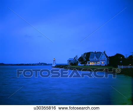 Stock Photograph - City view, outdoors, night time, lights, sky, water front. Fotosearch