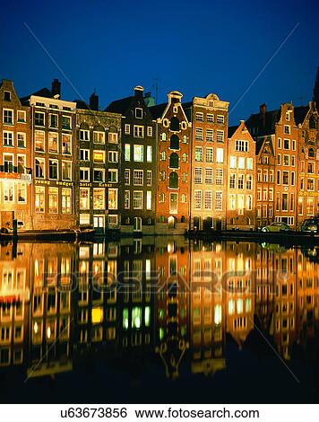 Stock Photograph - City view, outdoors, night time, lights, sky, water front. Fotosearch