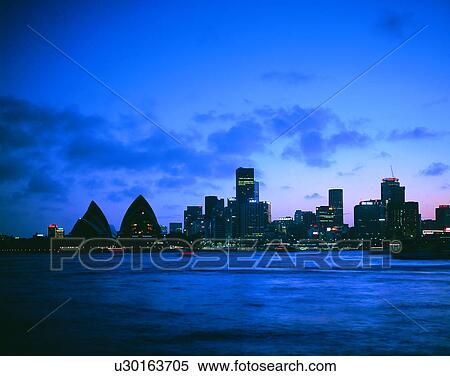 Stock Photography - City view, outdoors, night time, lights, sky, water front. Fotosearch