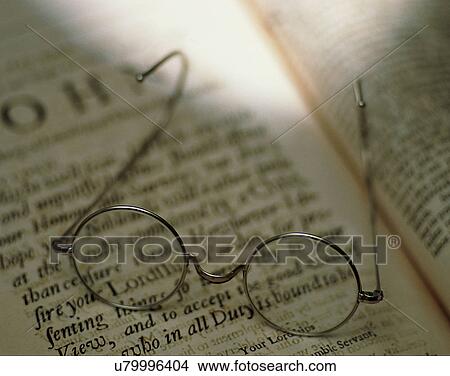 Picture - close-up, background, glasses, reading, book. Fotosearch