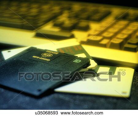 Stock Image - close-up, background, keyboard, floppy disc, black and white, soft light. Fotosearch
