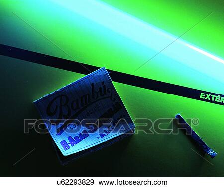 Stock Photo - close-up, background, match, neon light, desk. Fotosearch