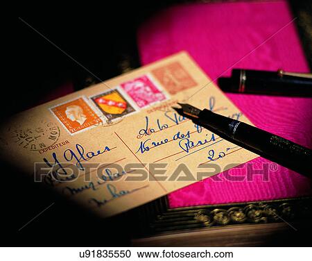 Stock Image - close-up, background, post cards, pen, stationary, stamp. Fotosearch
