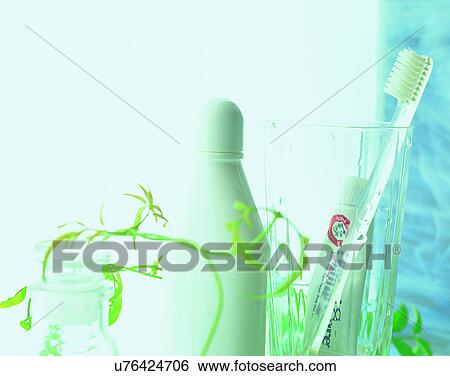 Stock Photograph - close-up, background, soft light, brush, tooth brush, glasses. Fotosearch