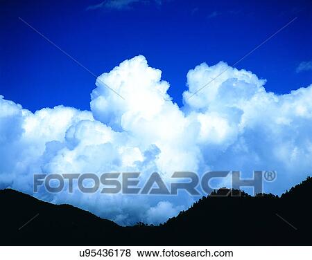 Stock Photo - clouds, sky, outdoors, daytime, mountain. Fotosearch