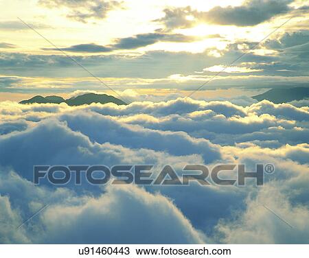 Stock Image - clouds, sky, outdoors, daytime, mountains, landscape. Fotosearch