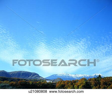 Stock Photo - clouds, sky, outdoors, daytime, mountains, landscape. Fotosearch