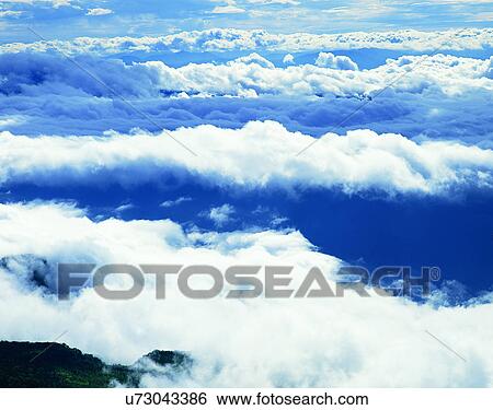 Stock Photograph - clouds, sky, outdoors, daytime, mountains, landscape. Fotosearch