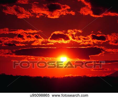Stock Photography - clouds, sky, outdoors, sunset, horizon, land. Fotosearch