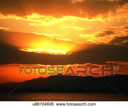 Stock Photograph - clouds, sky, outdoors, sunset, mountains, landscape. Fotosearch