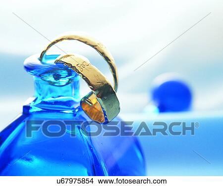 Picture - Color images, close-up, jewelry, luxury, ear rings, gold, bottle. Fotosearch