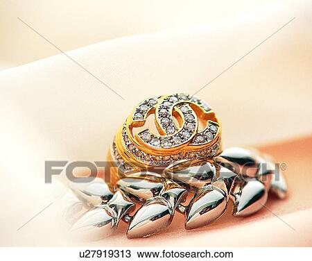 Stock Image - Color images, close-up, jewelry, luxury, ring, diamonds, gold. Fotosearch