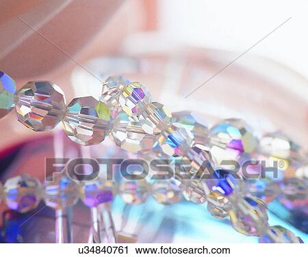 Stock Image - Color images, close-up, jewelry, luxury, necklace, glass, crystal. Fotosearch