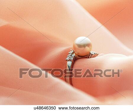 Stock Image - Color images, close-up, jewelry, luxury, ring, diamond, pearls. Fotosearch