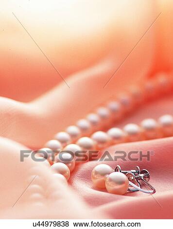Stock Photo - Color images, close-up, jewelry, luxury, ear rings, necklace. Fotosearch