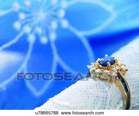 Stock Photo - Color images, close-up, jewelry, luxury, ring, diamond, gem. Fotosearch