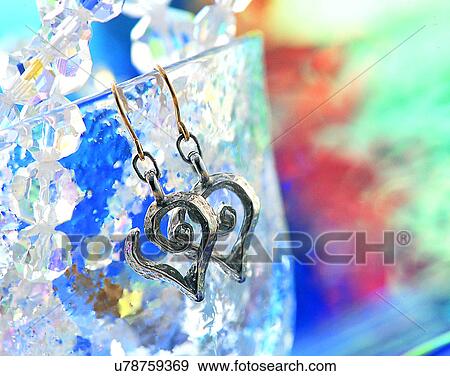 Stock Photo - Color images, close-up, jewelry, luxury, wineglass, earrings, silver. Fotosearch